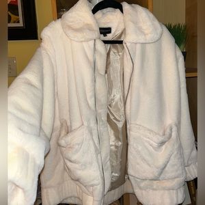 Silk-lined cream oversized faux fur jacket with collar